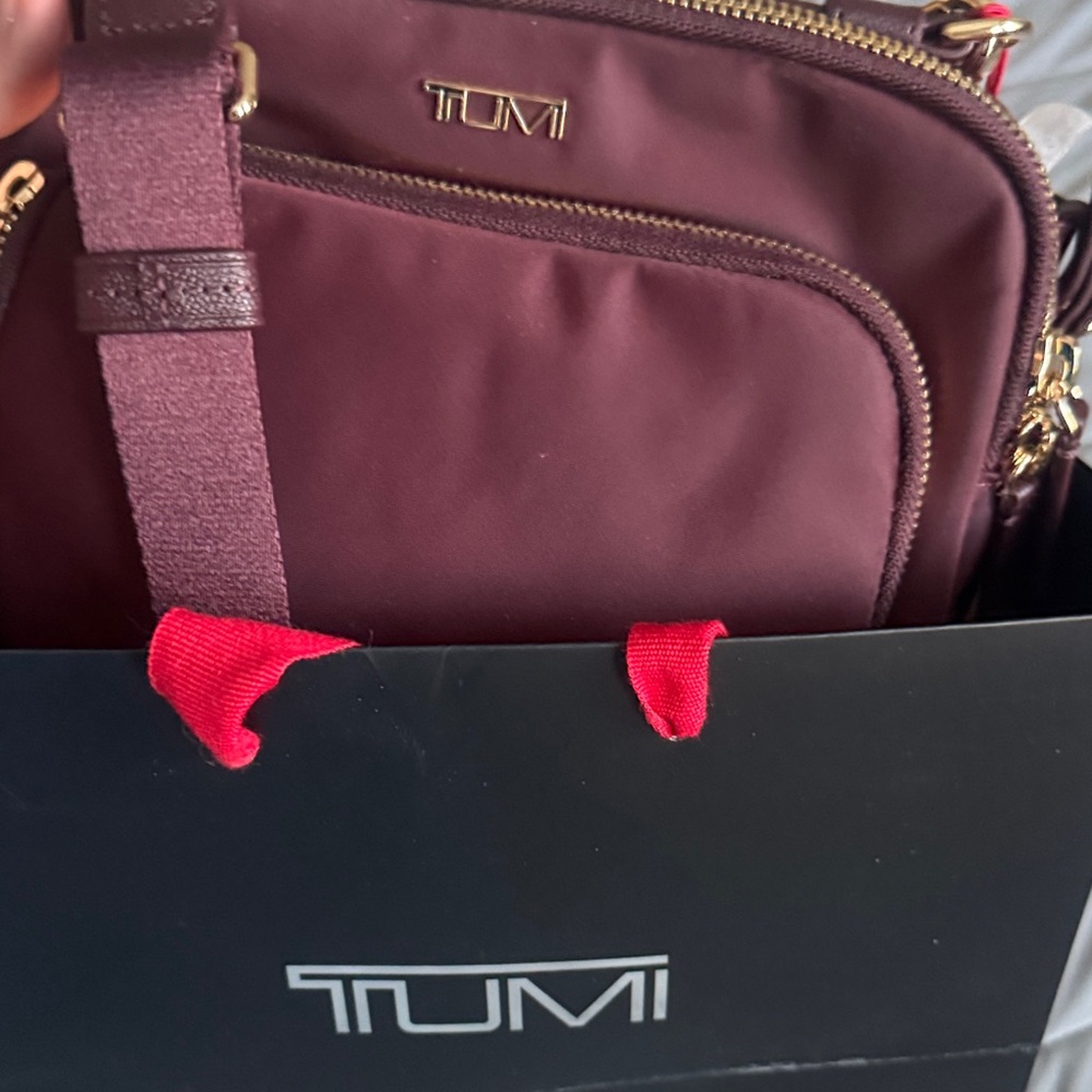 TUMI Maroon Shoulder Bag with Gold Accent -lightly used